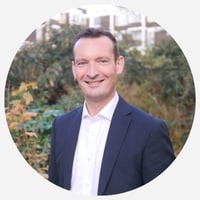 Mark Russell headshot - grey background Mark Russell headshot - grey background